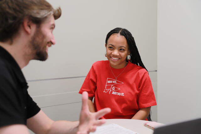 Student meeting with a staff member