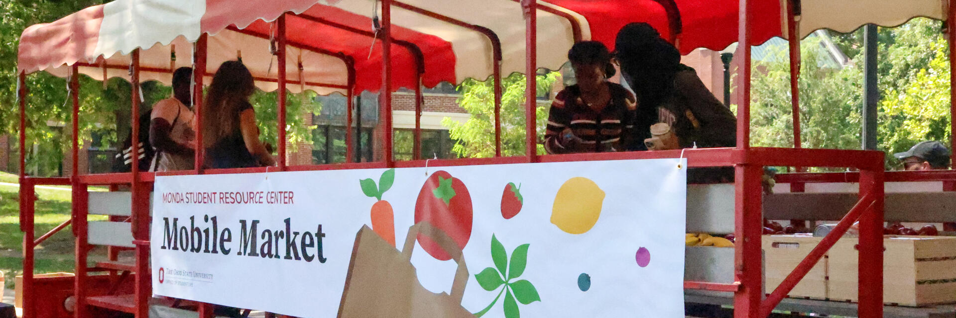 Students browse fresh produce and pantry items at the MSRC Mobile Market on campus.