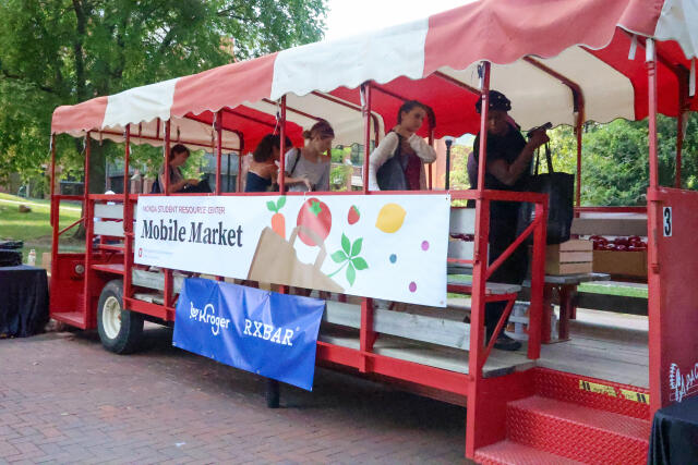 Students browse fresh produce and pantry items at the MSRC Mobile Market on campus.